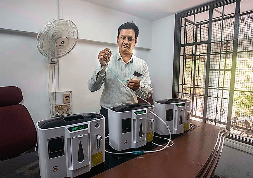 Sabir Shaikh with the oxygen concentrators that he provides to Covid-19 patients who don’t get hospital beds in time. (Pratham Gokhale/HT Photo)