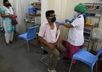 A medic administers the dose of COVID-19 vaccine to the people, during the second phase of a countrywide inoculation drive, at BYL Nair Hospital, in Mumbai. 
