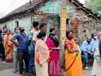 Voters stand in a queue to cast their votes during the sixth phase of West Bengal Assembly Election, in North 24 Paraganas on Thursday.(ANI Photo) Voters stand in a queue to cast their votes during the sixth phase of West Bengal Assembly Election, in North 24 Paraganas on Thursday.(ANI Photo)