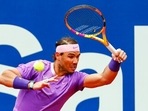 Rafael Nadal returns the ball to Ilya Ivashka of Belarus during the Godo tennis tournament in Barcelona,(AP) Rafael Nadal returns the ball to Ilya Ivashka of Belarus during the Godo tennis tournament in Barcelona,(AP)