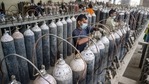 Workers refill cylinders with medical oxygen for supply to hospital for Covid-19 patients.(PTI Photo) Workers refill cylinders with medical oxygen for supply to hospital for Covid-19 patients.(PTI Photo)