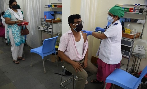 A medic administers the dose of COVID-19 vaccine to the people, during the second phase of a countrywide inoculation drive, at BYL Nair Hospital, in Mumbai. (Bhushan Koyande/ HT Photo)