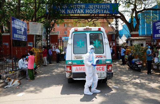 An ambulance waits for entry outside the Lok Nayak Jaiprakash Narayan COVID-19 hospital in New Delhi, India.  (AP)