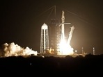 A SpaceX Falcon 9 rocket, with the Crew Dragon capsule, is launched carrying four astronauts on a Nasa commercial crew mission to the ISS.