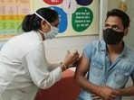 A health worker vaccinating a man against Covid-19 at Government Primary Health Center Bani Park in Jaipur, Rajasthan. (Himanshu Vyas/ Hindustan Times)