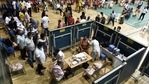 People wait for their turn to get the dose of the Covid-19 vaccine at an indoor stadium of RG Baruah Sports Complex in Guwahati on Thursday. (ANI photo) People wait for their turn to get the dose of the Covid-19 vaccine at an indoor stadium of RG Baruah Sports Complex in Guwahati on Thursday. (ANI photo)