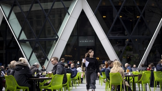 Diners outside one 30 St. Marys Axe, also known as The Gherkin, in London, UK. (Bloomberg) Diners outside one 30 St. Marys Axe, also known as The Gherkin, in London, UK. (Bloomberg)