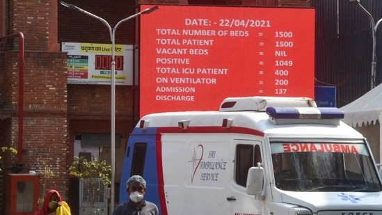 A digital information board notifies complete occupancy of Covid-19 beds at LNJP Hospital on April 22. At 9pm on April 22, there were a mere 15 ICU beds – of them only four with ventilators – remaining for Covid-19 patients in the national capital, the Delhi government’s hospital resource reporting app showed. The vacant beds accounted for 0.32% of the 4,663 ICU beds for Covid-19 cases. Of the 20,443 regular hospital beds for people with the coronavirus, only 10.5% -- or 2,141 – were available at the same time.(Amal KS / HT Photo)