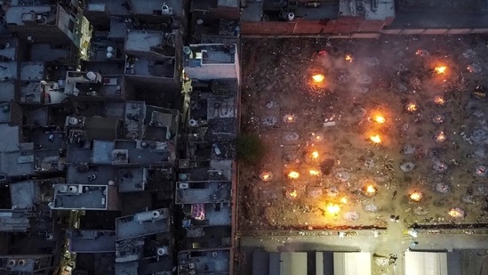 A mass cremation of victims who died due to the coronavirus disease (Covid-19), is seen at a crematorium ground in New Delhi on April 22. India reported 332,730 cases for the last 24 hours on the morning of April 23, pushing the country’s total infection count to 16,263,695 cases. Deaths rose by 2,263 to reach a total of 186,920, according to health ministry data.(Danish Siddiqui / REUTERS)