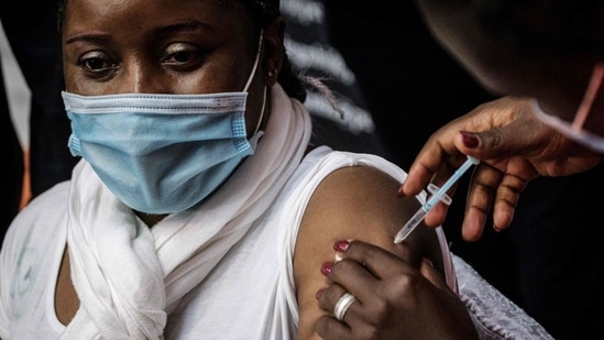 A Kenyan woman receives the first injection of the Oxford/AstraZeneca Covid-19 vaccine during the launch of the vaccination campaign for 5000 frontline workers in the tourism and hospitality sector in Nairobi county at the Kenyatta International Convention Centre (KICC) in Nairobi, Kenya, on April 21, 2021. (Representational Image) (AFP) A Kenyan woman receives the first injection of the Oxford/AstraZeneca Covid-19 vaccine during the launch of the vaccination campaign for 5000 frontline workers in the tourism and hospitality sector in Nairobi county at the Kenyatta International Convention Centre (KICC) in Nairobi, Kenya, on April 21, 2021. (Representational Image) (AFP)