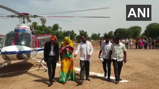 The image shows the family from Rajasthan's Nagaur district bringing home the child in helicopter. (Twitter/@ANI)