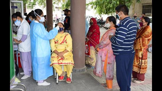 A health worker sampling residents for Covid test at the civil surgeon’s office in Civil Lines, Ludhiana, on Friday. (Gurpreet Singh/HT) A health worker sampling residents for Covid test at the civil surgeon’s office in Civil Lines, Ludhiana, on Friday. (Gurpreet Singh/HT)