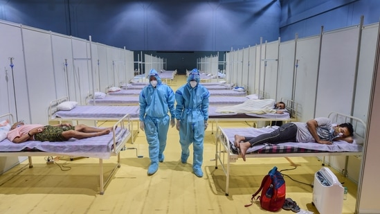 Medics inside the Covid-19 emergency ward at Yamuna Sports Complex, New Delhi, as coronavirus disease cases surge across India. (Kamal Kishore / PTI)