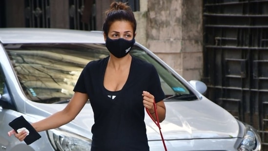 Malaika Arora snapped taking a walk in Bandra with her pet dog Casper.(Varinder Chawla)