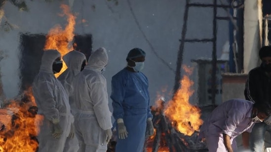 With the ceaseless arrival of dead bodies on Thursday, crematorium staff said they had to burn bodies round-the-clock at every available space. (AP Photo)