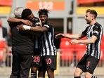 Newcastle United's Joe Willock celebrates scoring their first goal with manager Steve Bruce, Allan Saint-Maximin and Paul Dummett.