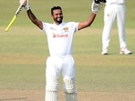 Dimuth Karunaratne celebrates scoring his double century during the fourth day of the first test cricket match between Sri Lanka and Bangladesh in Pallekele.(AP) Dimuth Karunaratne celebrates scoring his double century during the fourth day of the first test cricket match between Sri Lanka and Bangladesh in Pallekele.(AP)