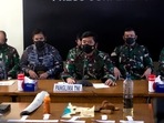 Indonesian Military chief Hadi Tjahjanto, center, talks to media as they display debris found in the waters during a search for The Indonesian Navy submarine KRI Nanggala at Ngurah Rai Military Air Base in Bali, Indonesia. Indonesian Military chief Hadi Tjahjanto, center, talks to media as they display debris found in the waters during a search for The Indonesian Navy submarine KRI Nanggala at Ngurah Rai Military Air Base in Bali, Indonesia.