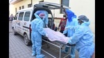 Health workers putting a body into a vehicle after six Covid patients died at Neelkanth Hospital in Amritsar, on Saturday. (Sameer Sehgal /Hindustan Times) Health workers putting a body into a vehicle after six Covid patients died at Neelkanth Hospital in Amritsar, on Saturday. (Sameer Sehgal /Hindustan Times)