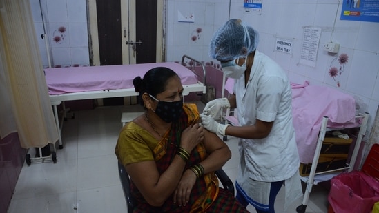 Beneficiary gets vaccinated at a centre in Thane. (Praful Gangurde / HT Photo)