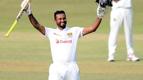 Dimuth Karunaratne celebrates scoring his double century during the fourth day of the first test cricket match between Sri Lanka and Bangladesh in Pallekele.(AP)