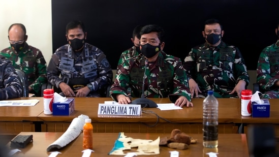 Indonesian Military chief Hadi Tjahjanto, center, talks to media as they display debris found in the waters during a search for The Indonesian Navy submarine KRI Nanggala at Ngurah Rai Military Air Base in Bali, Indonesia. (AP) Indonesian Military chief Hadi Tjahjanto, center, talks to media as they display debris found in the waters during a search for The Indonesian Navy submarine KRI Nanggala at Ngurah Rai Military Air Base in Bali, Indonesia. (AP)