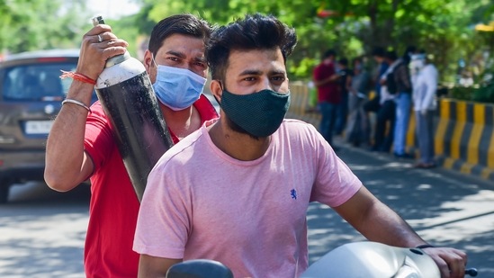People move in search of medical oxygen required for treatment of Covid-19 patients, in Indirapuram, Ghaziabad, Saturday, April 24, 2021. (PTI) People move in search of medical oxygen required for treatment of Covid-19 patients, in Indirapuram, Ghaziabad, Saturday, April 24, 2021. (PTI)