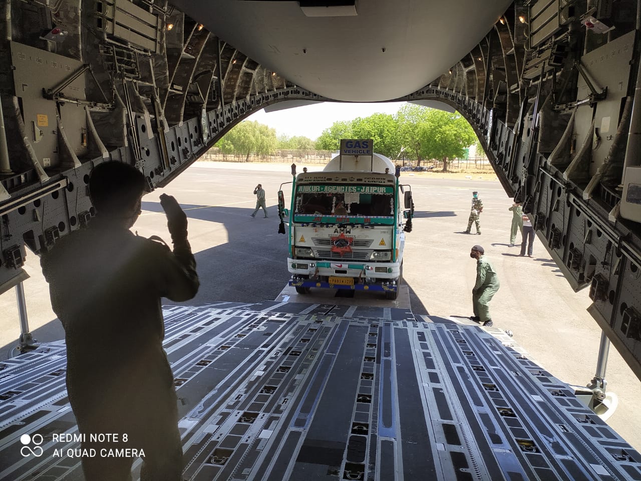 Oxygen tank is being lifted inside an aircraft. Oxygen tank is being lifted inside an aircraft.