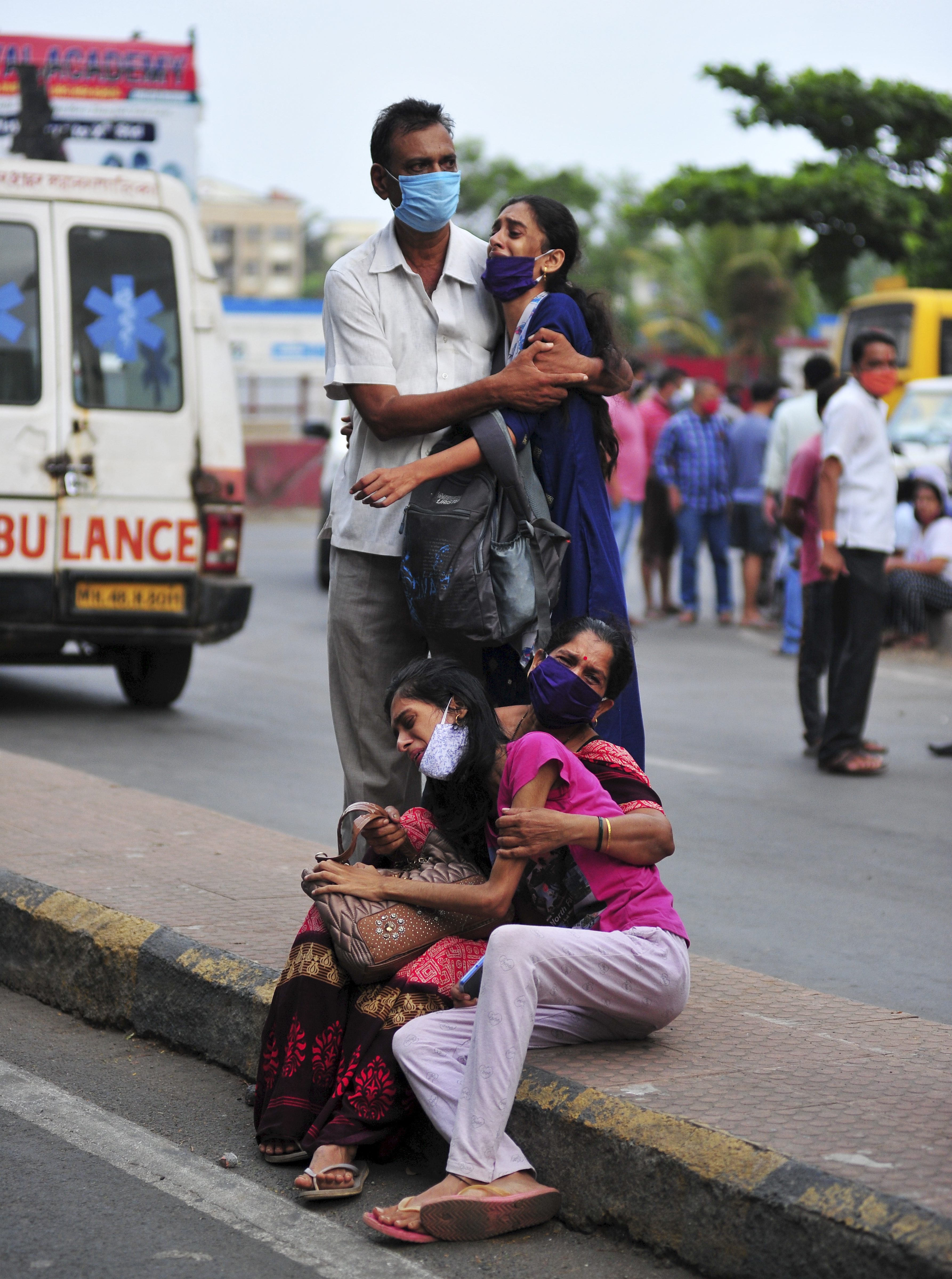 People mourn deaths of their relatives in a fire at a Covid-19 hospital in Vasai, Maharashtra. Thirteen Covid-19 patients die in the hospital fire in Maharashtra. (PTI) People mourn deaths of their relatives in a fire at a Covid-19 hospital in Vasai, Maharashtra. Thirteen Covid-19 patients die in the hospital fire in Maharashtra. (PTI)