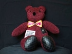A teddy bear made with pieces of clothing that were worn by a Covid-19 victim, sits in the workshop of seamstress Irma de la Parra, in Mexico City. A teddy bear made with pieces of clothing that were worn by a Covid-19 victim, sits in the workshop of seamstress Irma de la Parra, in Mexico City.