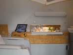 The image shows a first class cabin of an Emirates flight.