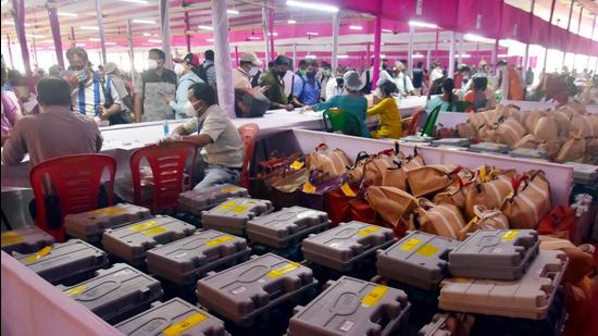 West Bengal: Polling officials and election staff wait to collect EVM machines and other material from an EVM distribution centre on the eve of the 7th phases of the West Bengal assembly election in Kolkata. (ANI) West Bengal: Polling officials and election staff wait to collect EVM machines and other material from an EVM distribution centre on the eve of the 7th phases of the West Bengal assembly election in Kolkata. (ANI)