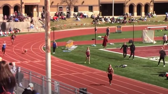 The video of the dog crashing a relay race has gone all kinds of viral.(YouTube/@MileSplit)