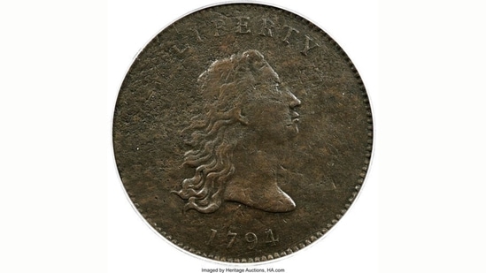 This undated photo provided by Heritage Auctions shows the front of a piece of copper that was struck by the US Mint in Philadelphia in 1794 and was a prototype for the fledgling nation's money.(AP) This undated photo provided by Heritage Auctions shows the front of a piece of copper that was struck by the US Mint in Philadelphia in 1794 and was a prototype for the fledgling nation's money.(AP)