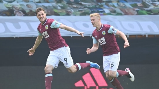 Burnley's Chris Wood, left, celebrates after scoring his side's third goal during the English Premier League soccer match between Wolves and Burnley.(AP) Burnley's Chris Wood, left, celebrates after scoring his side's third goal during the English Premier League soccer match between Wolves and Burnley.(AP)