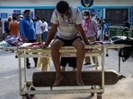 A patient suffering from the coronavirus disease waits to get admitted outside the casualty ward at Guru Teg Bahadur Hospital amid the spread of the disease in New Delhi.