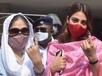 Kolkata: TMC MP Nusrat Jahan (R) with her mother shows her finger marked with indelible ink after casting her vote during the 7th phase of the West Bengal State Assembly polls, at a polling station, in Kolkata, Monday, April 26, 2021. (PTI Photo/Swapan Mahapatra) Kolkata: TMC MP Nusrat Jahan (R) with her mother shows her finger marked with indelible ink after casting her vote during the 7th phase of the West Bengal State Assembly polls, at a polling station, in Kolkata, Monday, April 26, 2021. (PTI Photo/Swapan Mahapatra)