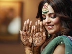 Sugandha Mishra posing with her henna-decorated hands. Sugandha Mishra posing with her henna-decorated hands.