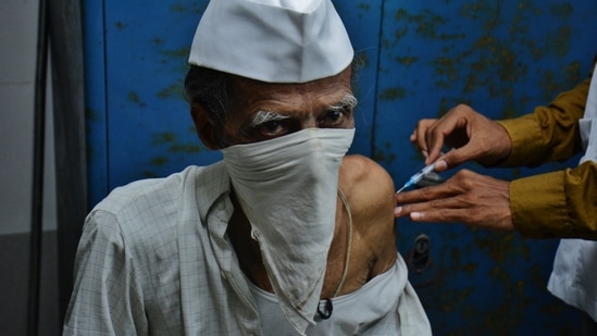 A medic administers Covid-19 vaccine to a senior citizen at TMC's C.R. Wadia Hospital, in Thane, Mumbai, India, on Monday, April 26, 2021. ( Praful Gangurde / HT Photo )