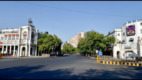 Connaught Place area wears a deserted look during the Covid-induced lockdown, in New Delhi on Sunday, April 25. (PTI) Connaught Place area wears a deserted look during the Covid-induced lockdown, in New Delhi on Sunday, April 25. (PTI)