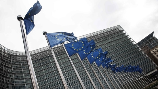 European Union flags fly outside the headquarters of the European Commission in Brussels.(AFP)