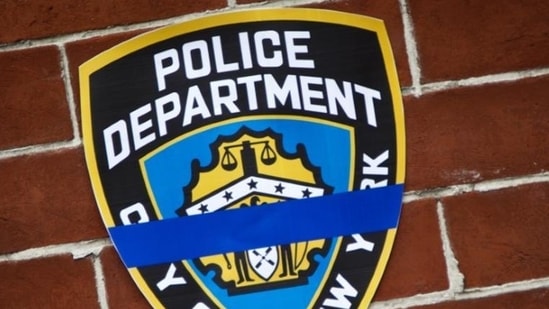 The NYPD logo pictured on a wall above a makeshift memorial in Brooklyn borough of New York (Reuters File Photo). The NYPD logo pictured on a wall above a makeshift memorial in Brooklyn borough of New York (Reuters File Photo).