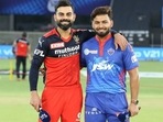 RCB captain Virat Kohli (L) poses with DC skipper Rishabh Pant for the toss