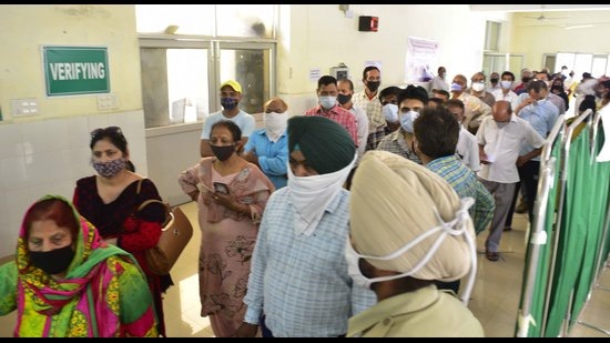 Local residents stand in queues outside a vaccination counter at the civil surgeon’s office in Ludhiana on Tuesday. (Gurpreet Singh/HT) Local residents stand in queues outside a vaccination counter at the civil surgeon’s office in Ludhiana on Tuesday. (Gurpreet Singh/HT)