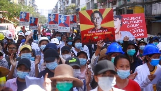 Anti-coup protesters hold up images of deposed leader Aung San Suu Kyi as they gather in Yangon, Myanmar. (AP file photo) Anti-coup protesters hold up images of deposed leader Aung San Suu Kyi as they gather in Yangon, Myanmar. (AP file photo)