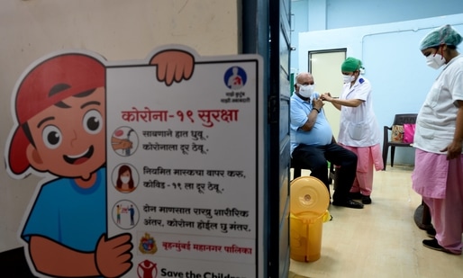 A beneficiary gets inoculated with a dose of the Covishield, AstraZeneca-Oxford's Covid-19 coronavirus vaccine, at Rajawadi vaccination centre in Mumbai. (Satish Bate/Hindustan Times)