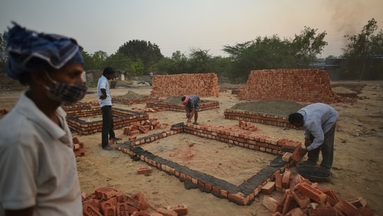 Cremation platforms being built outside Sarai Kale Khan crematorium to accommodate Covid-19 deaths, in New Delhi on April 26. India has converted hotels and railway coaches into critical care facilities, but experts warn the next crisis will be a shortage of healthcare professionals. (Amal KS / HT Photo) Cremation platforms being built outside Sarai Kale Khan crematorium to accommodate Covid-19 deaths, in New Delhi on April 26. India has converted hotels and railway coaches into critical care facilities, but experts warn the next crisis will be a shortage of healthcare professionals. (Amal KS / HT Photo)