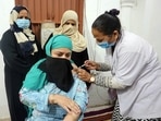 A medic administers the Covishield vaccine to a beneficiary during a nationwide vaccination drive at Taj-ul-Masajid in Bhopal. (ANI Photo) A medic administers the Covishield vaccine to a beneficiary during a nationwide vaccination drive at Taj-ul-Masajid in Bhopal. (ANI Photo)
