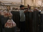 Workers are seen sorting oxygen cylinders that are being used for Covid-19 coronavirus patients before dispatching them to hospitals at a facility on the outskirts of Amritsar on April 28, 2021. (AFP) Workers are seen sorting oxygen cylinders that are being used for Covid-19 coronavirus patients before dispatching them to hospitals at a facility on the outskirts of Amritsar on April 28, 2021. (AFP)