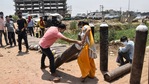 A family member of a Covid-19 patient carries an oxygen cylinder for refilling outside a filling centre, in Patna, Wednesday.(PTI) A family member of a Covid-19 patient carries an oxygen cylinder for refilling outside a filling centre, in Patna, Wednesday.(PTI)